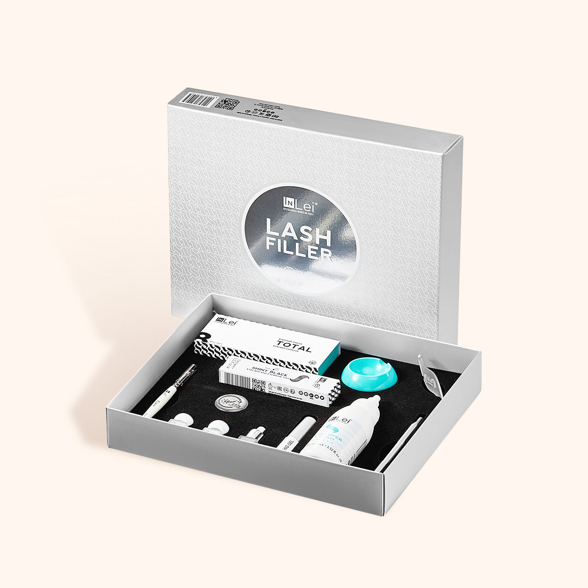 Kit completo de InLei® Lash Filler para lifting de pestañas, mostrando los frascos de tratamiento, almohadillas de silicona y herramientas en una mesa de trabajo