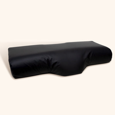Funda de almohada de piel sintética, ideal para aportar un toque de lujo y confort a cualquier dormitorio